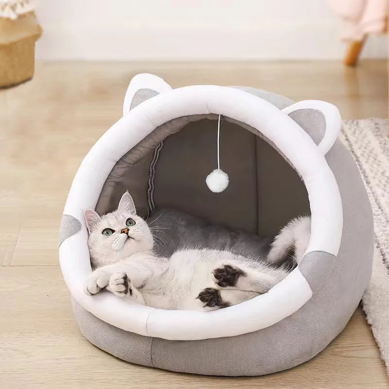Self-warming cave bed for cats