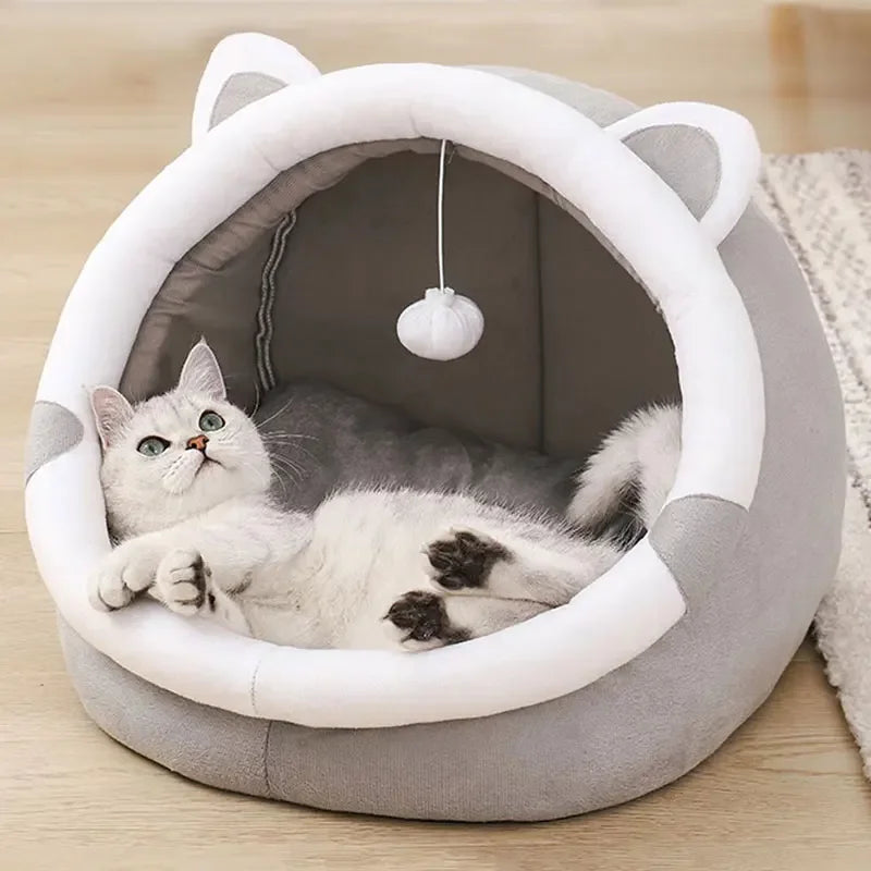 Self-warming cave bed for cats